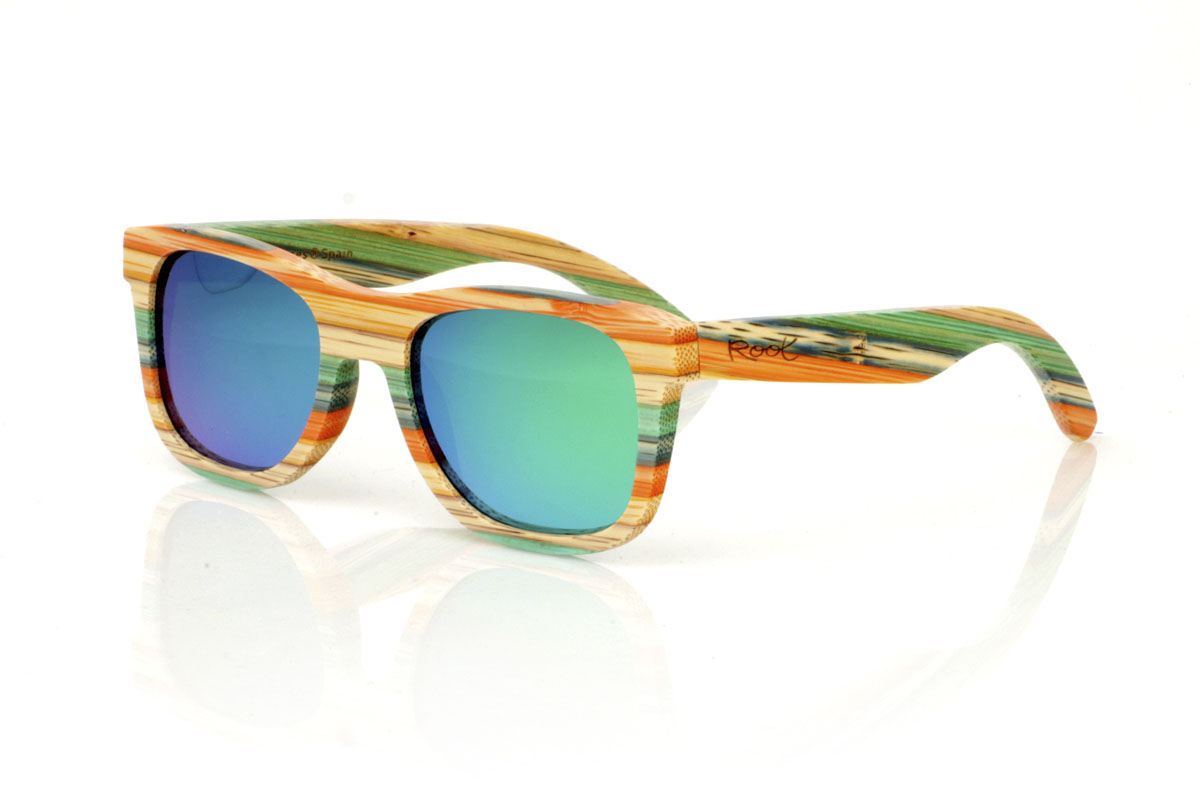 Wood eyewear of Bamboo KASHBAH. KASHBAH sunglasses, with a classic design and a slightly smaller size than the standard, make the difference in our bamboo collection. These glasses are made of vertically laminated bamboo wood, creating a pattern of soft colors that capture the light and the gaze of whoever sees them. The colorful result is not only visually attractive, but also adds a touch of originality and freshness to your style. With measurements of 143x46 and a caliber of 52, the KASHBAH are perfect for those looking for comfortable, light glasses with a unique touch that will not go unnoticed. for Wholesale & Retail | Root Sunglasses® 